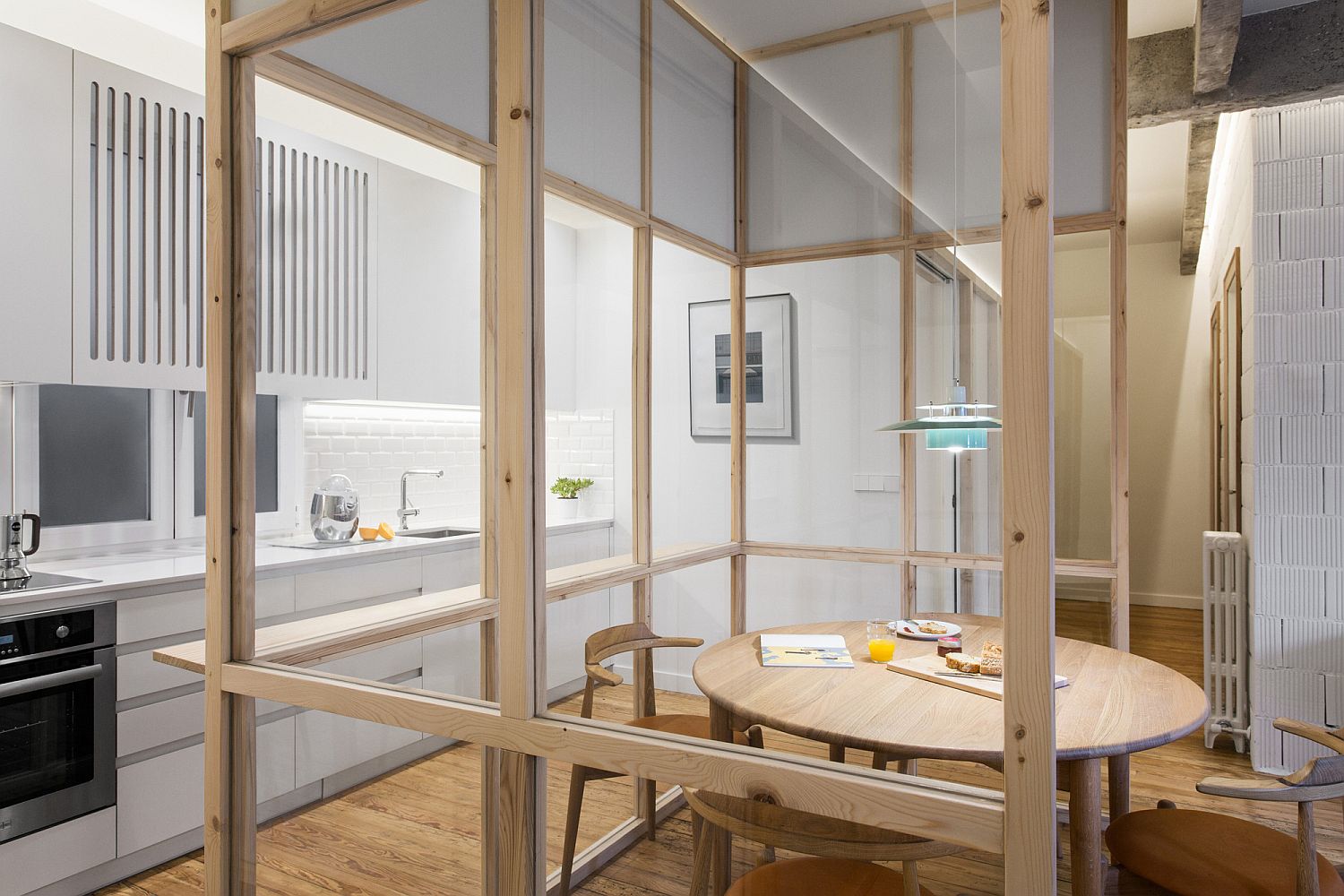 Crafting-a-dining-room-within-the-kitchen-using-wood-and-glass-partitions