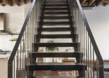 Custom-wood-and-steel-stairway-leading-to-the-private-bedroom-level-217x155