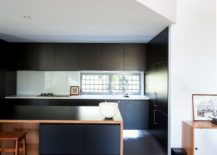 Dark-cabinets-of-the-kitchen-present-a-contrasting-image-217x155