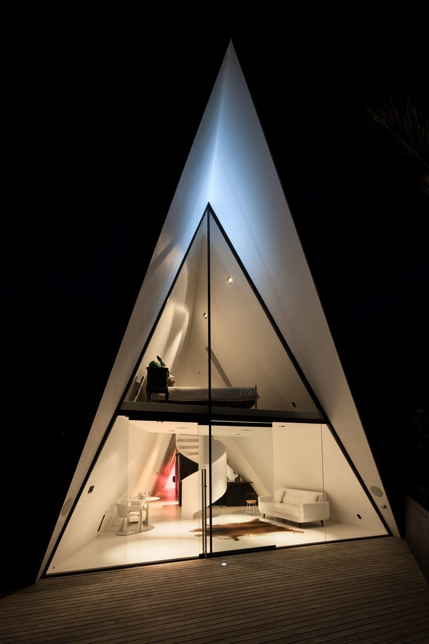 Dark exterior of the tent house allows it to blend into the backdrop