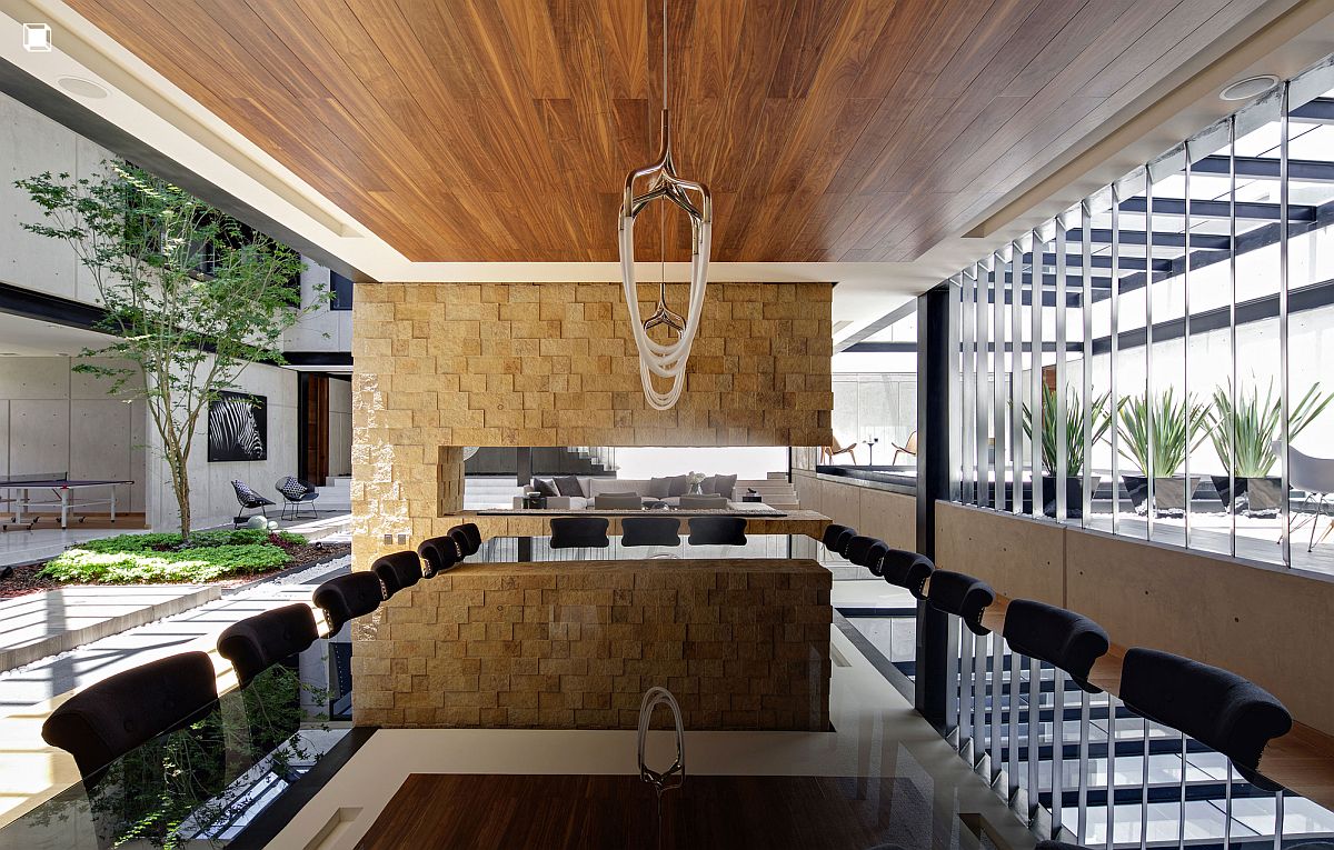 Dining area has an open airy appeal thanks to the two covered terraces next to it