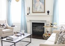 Exquisite-living-room-in-white-with-light-blue-drapes-and-French-finesse-217x155
