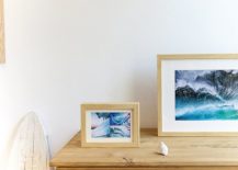 Framed-images-of-sand-and-surf-add-to-the-beach-style-of-the-bedroom-217x155