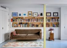 Funtional-wall-delineates-space-while-providing-ample-shelf-space-for-books-217x155