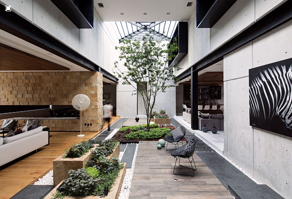 Living-area-of-the-Ro-House-connected-with-the-double-height-covered-patio-next-to-it