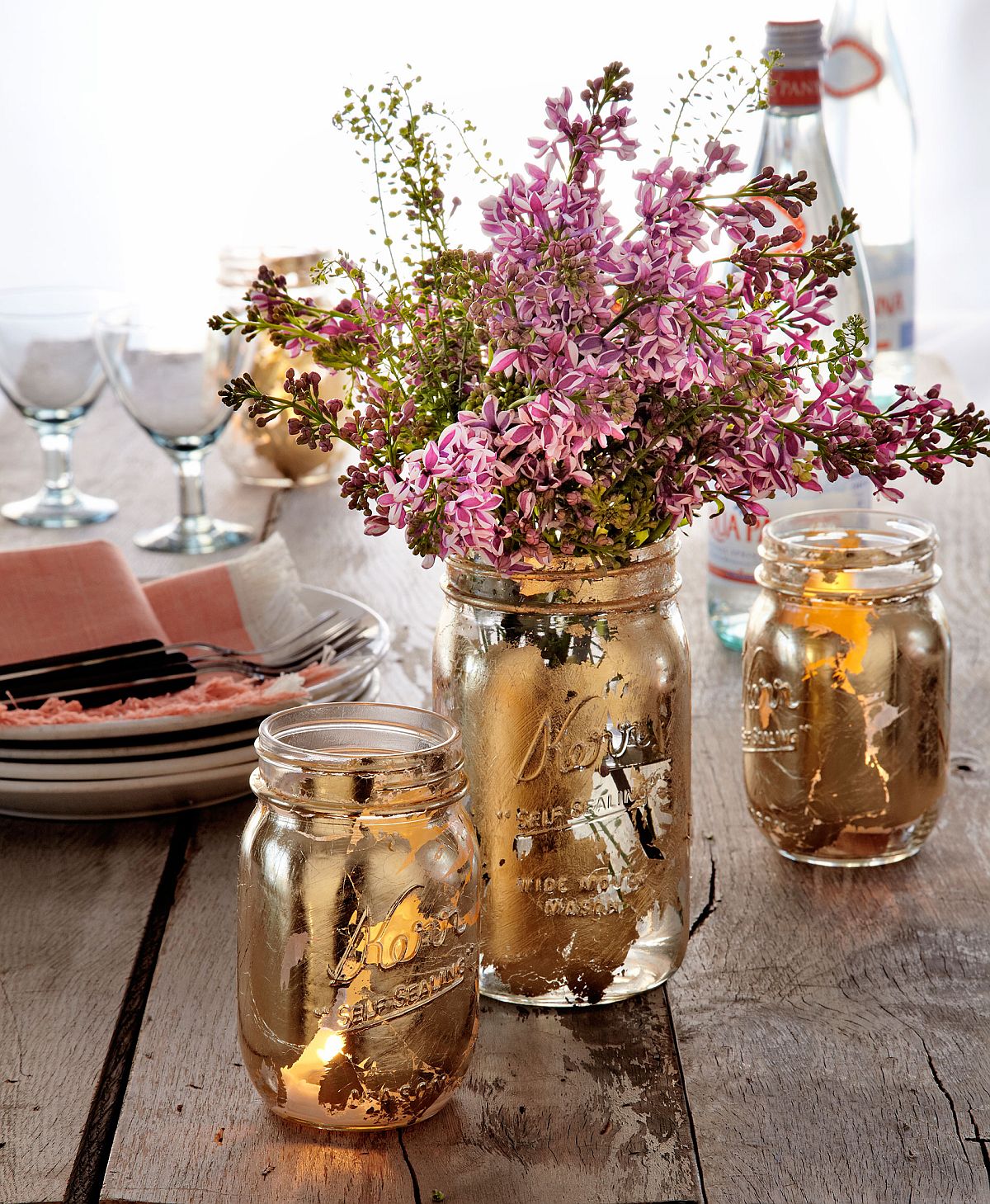 Mason jar painted in gold can double as perfect fall table centerpieces and cool planters!