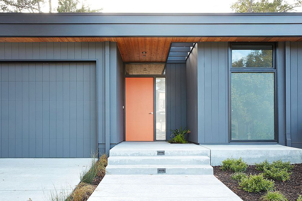 Modern home in California with a bright orange door inspired by classic Eichler homes