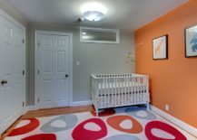 Modern-nursery-with-spunky-orange-accent-wall-217x155