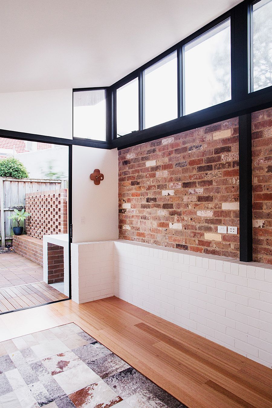 Old exposed brick wall is combined with recycled brick wall outside