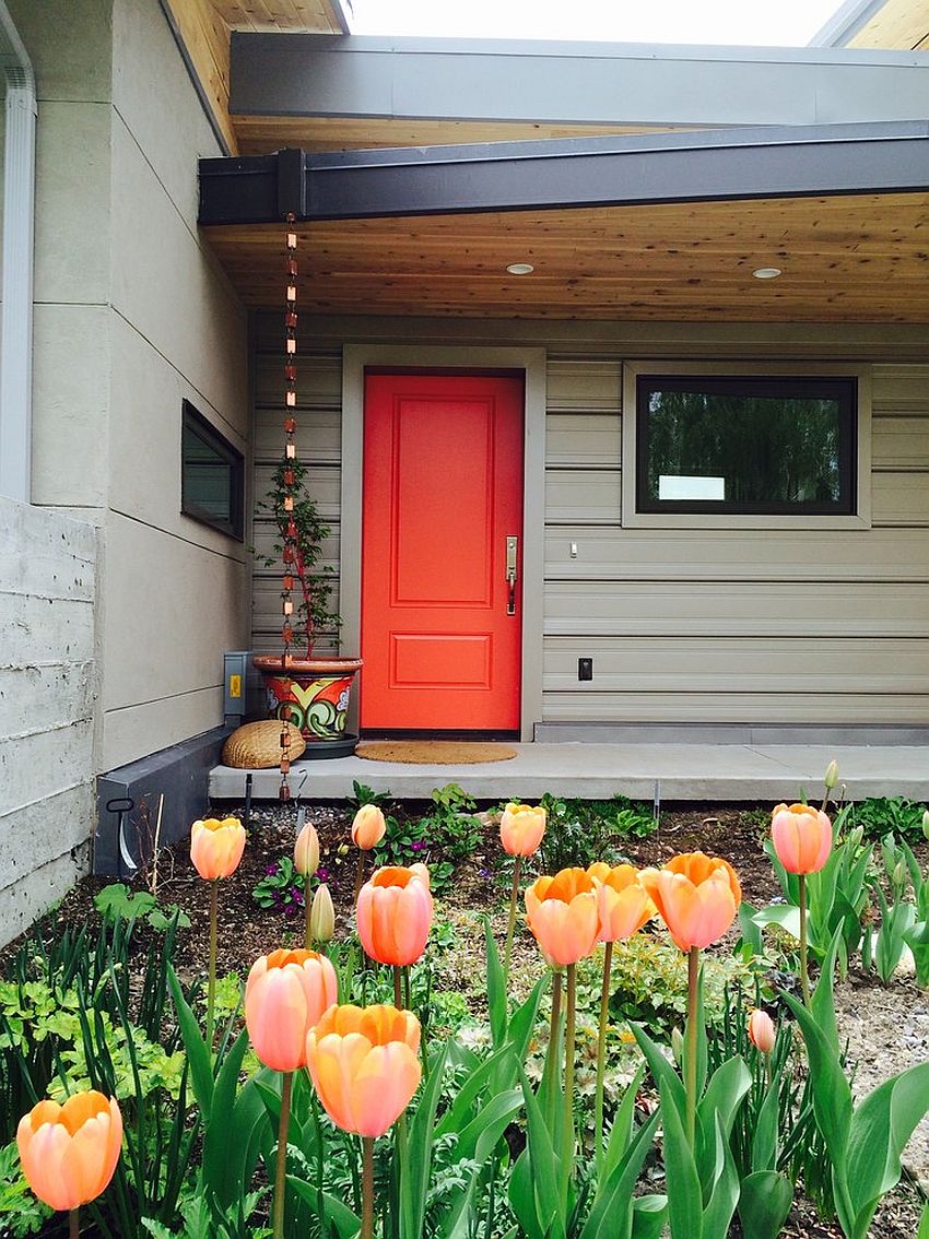 Orange-door-gives-the-gray-exterior-a-stylish-focal-point