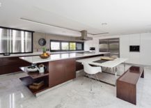 Polished-modern-kitchen-in-white-with-dark-wooden-cabinets-and-breakfast-bench-217x155