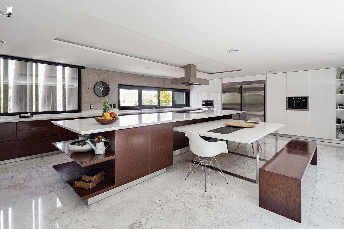 Polished modern kitchen in white with dark wooden cabinets and breakfast bench