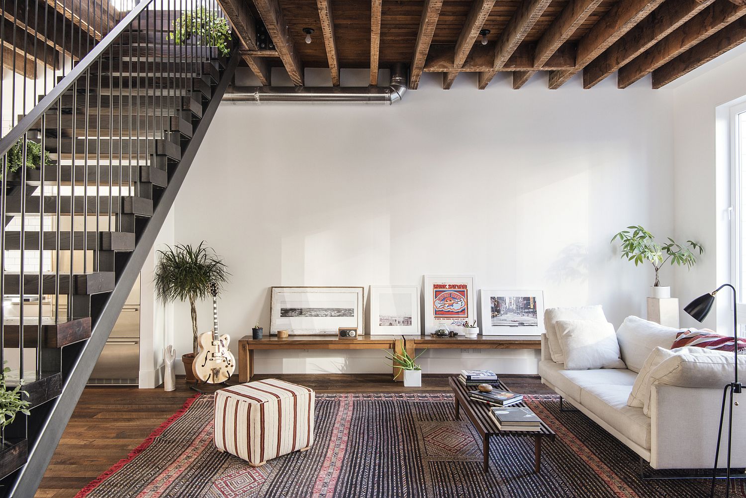 Reclaimed wood floors and custom wood and steel staircase revamp the Lorimer Street Townhouse