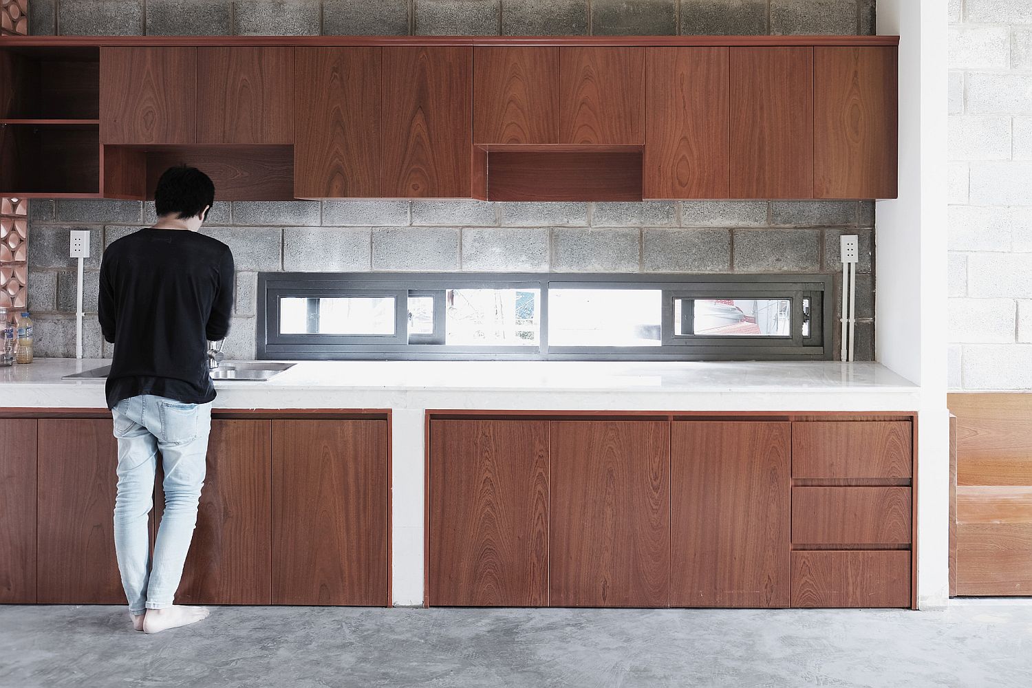 Small-and-narrow-window-above-the-kitchen-station-brings-in-natural-light-1