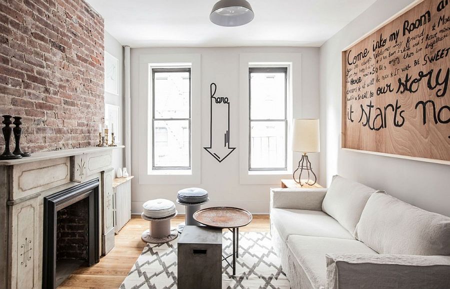 Small living room in white of New York City apartment with exposed brick wall