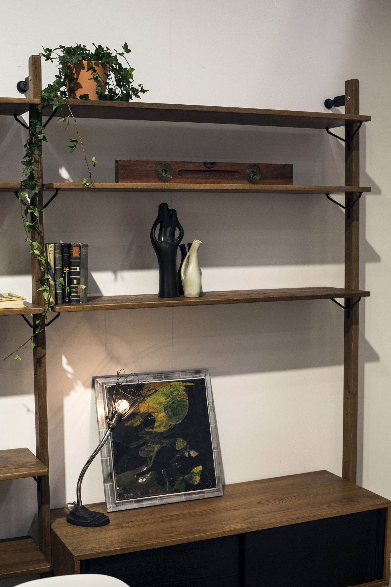 Space-savvy floating shelves add industrial charm to the modern living room