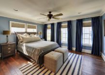 Spacious-and-light-filled-traditional-bedroom-with-gorgeous-blue-curtains-217x155