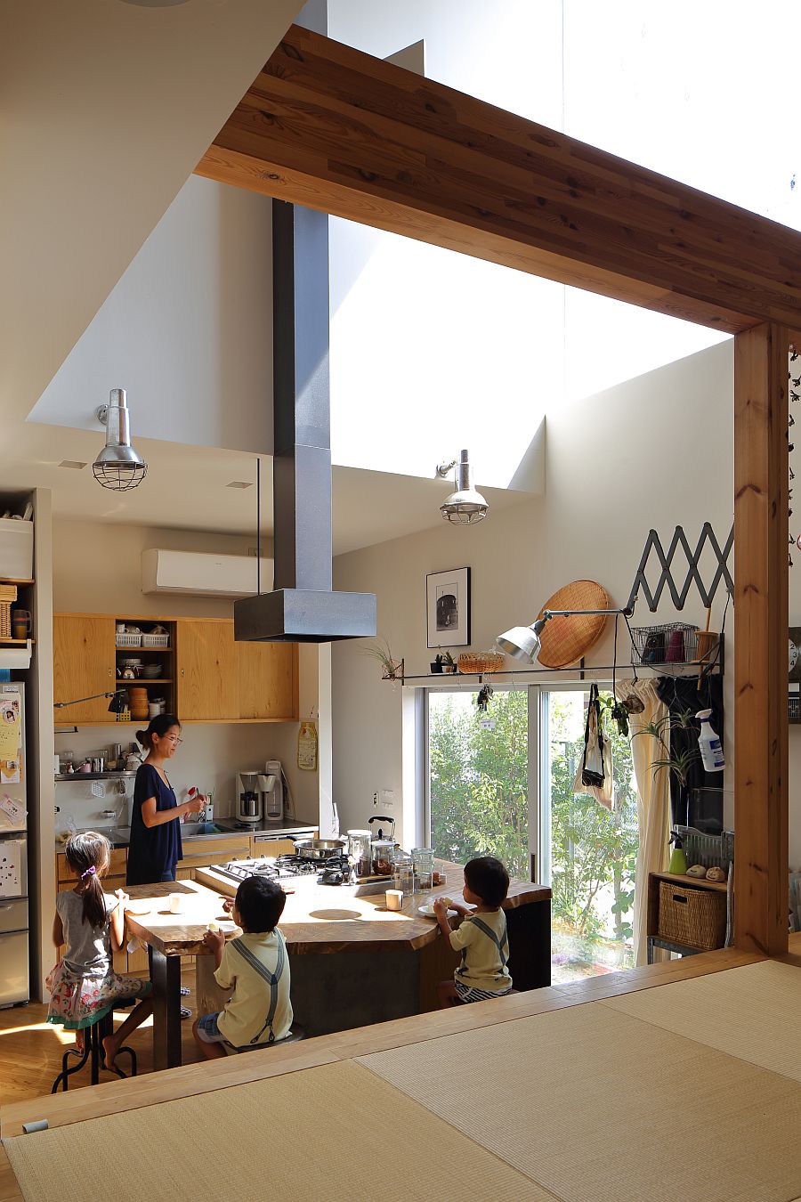 Spacious, double-height kitchen of the house also serves as the gathering space for entire family