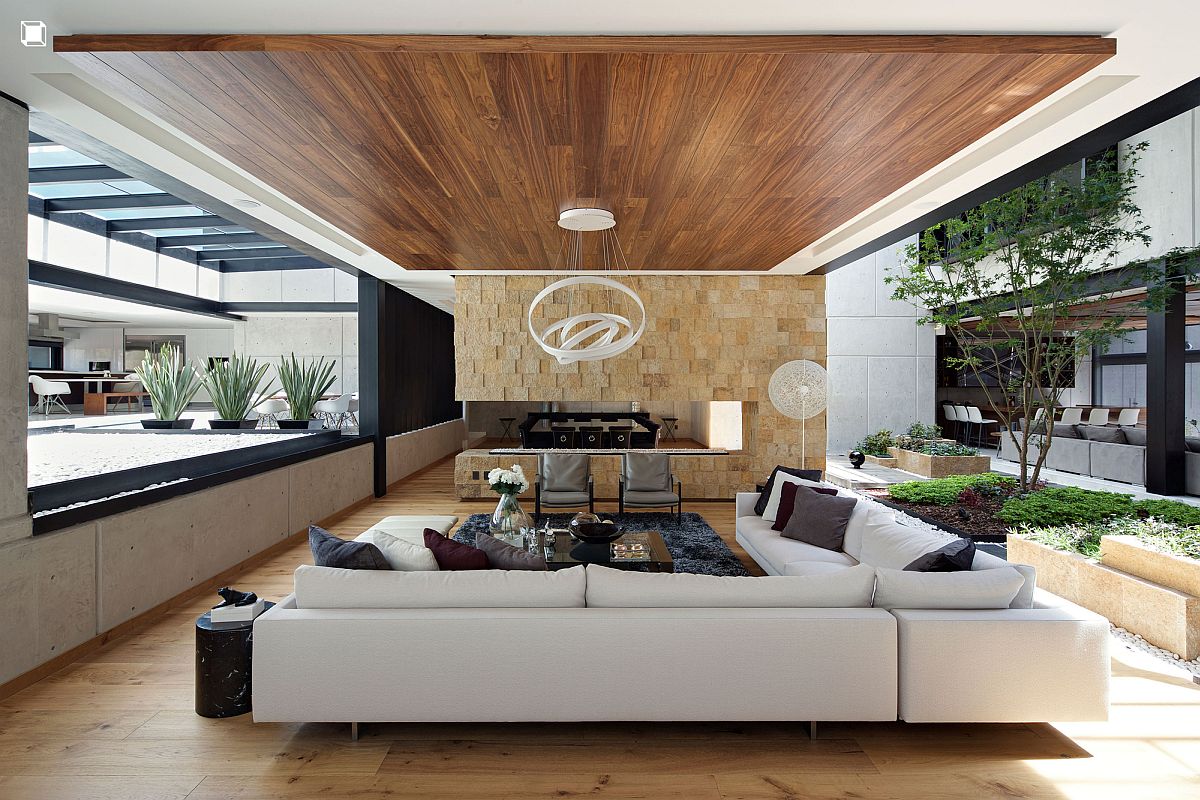 Stone wall separates the dining area from the family space