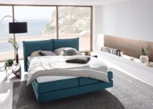 Stylish-bedroom-with-lovely-floor-lamp-blue-bed-and-smart-shelving-217x155