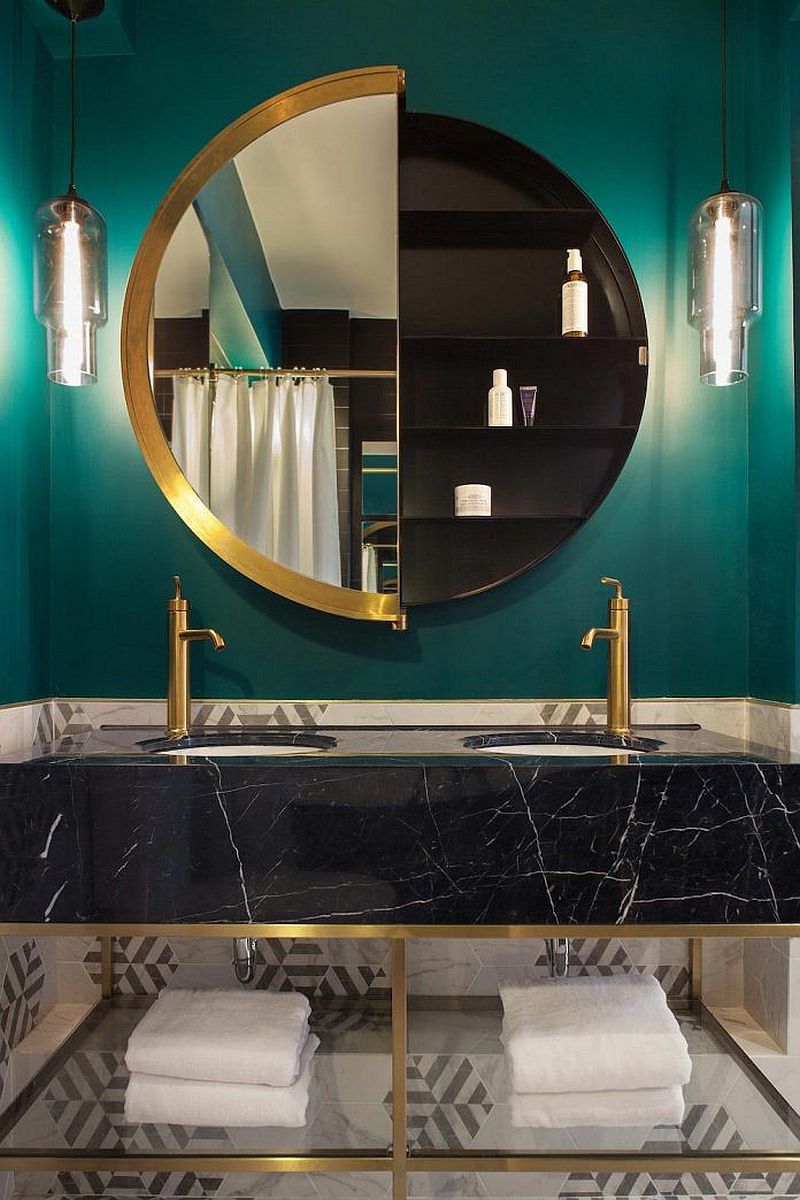 Warm metallics bring brightness to the stylish powder room