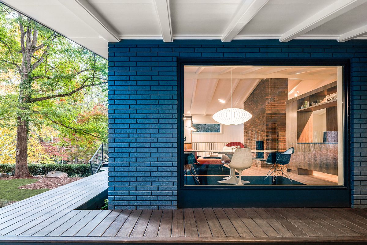 Brick and glass give the home a gorgeous Mid-century modern aesthetic