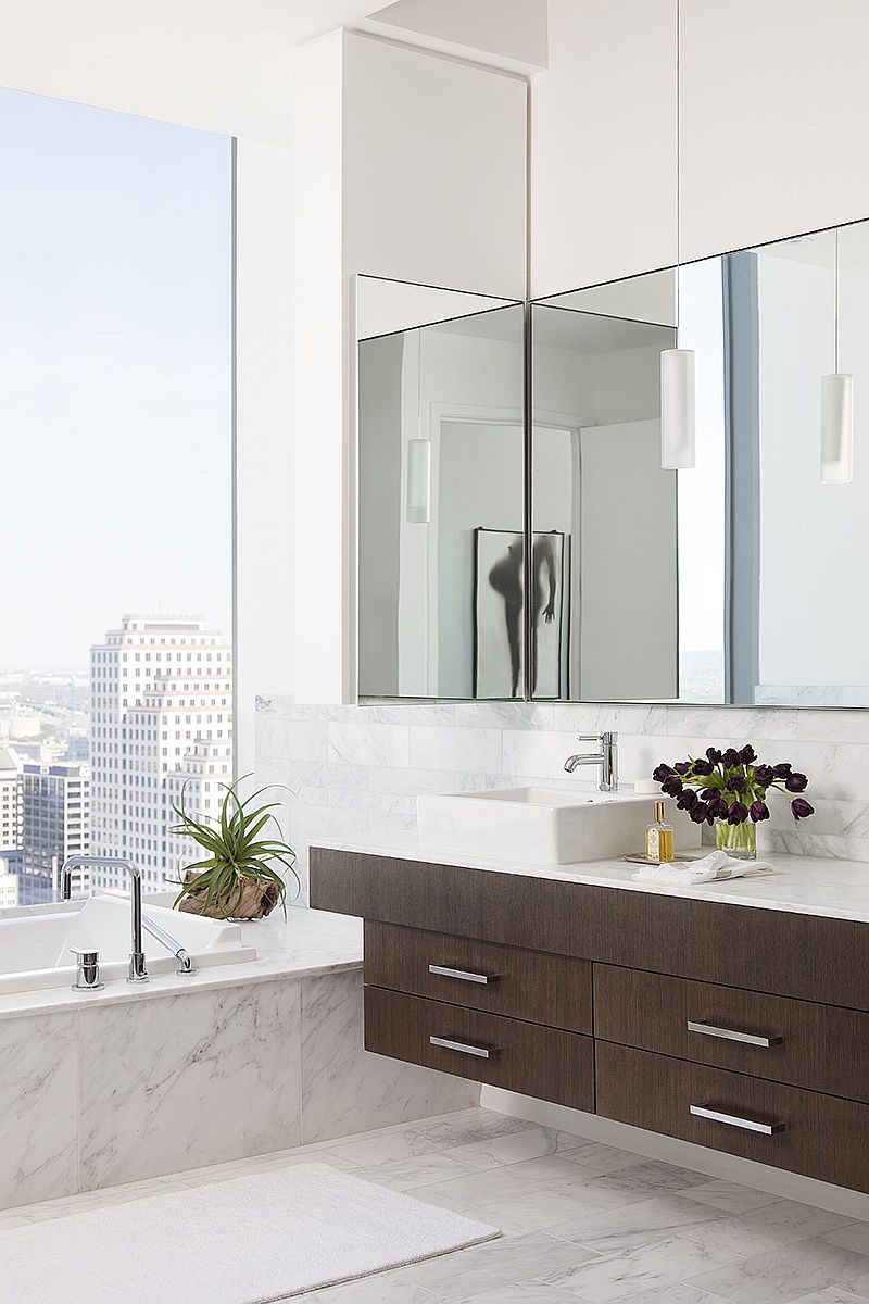 Contemporary bathroom draped in wood and marble with stunning views of downtown Austin and beyond