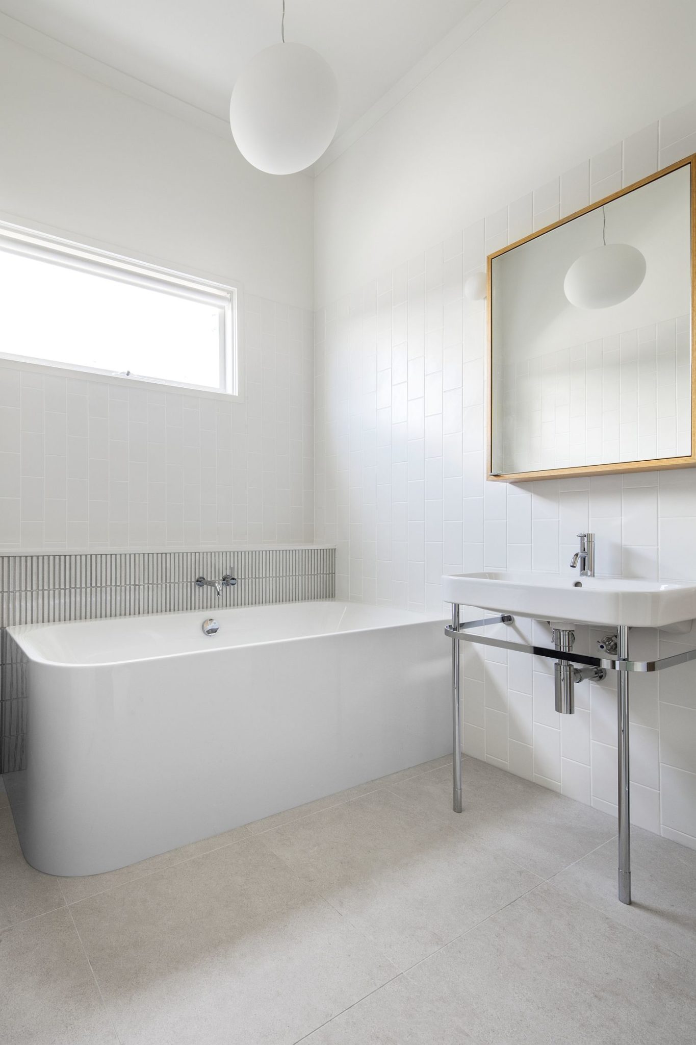 Contemporary bathroom in white with timber accents