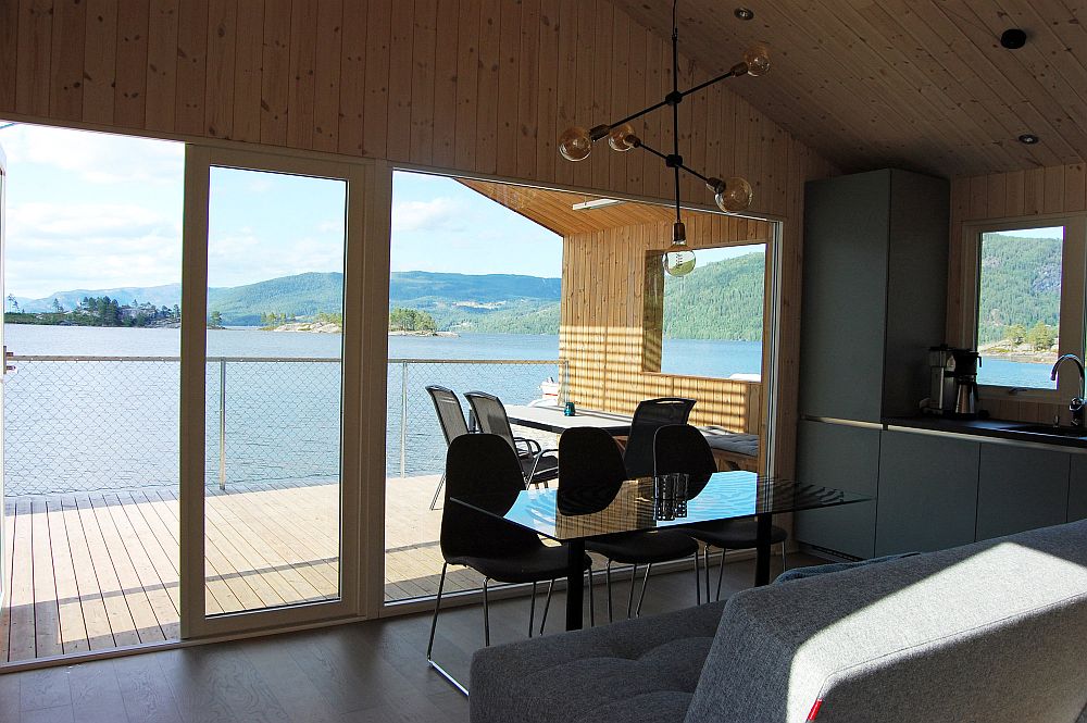 Dining and kitchen on cabin next to lake