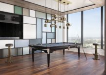 Dining-table-transformed-into-the-pool-table-with-chandelier-above-that-also-morphs-217x155