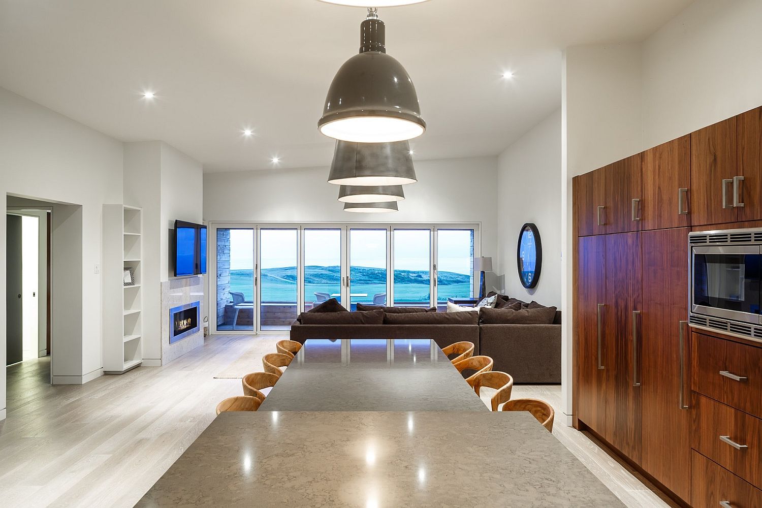 Expansive and open dining room next to living area with ocean views