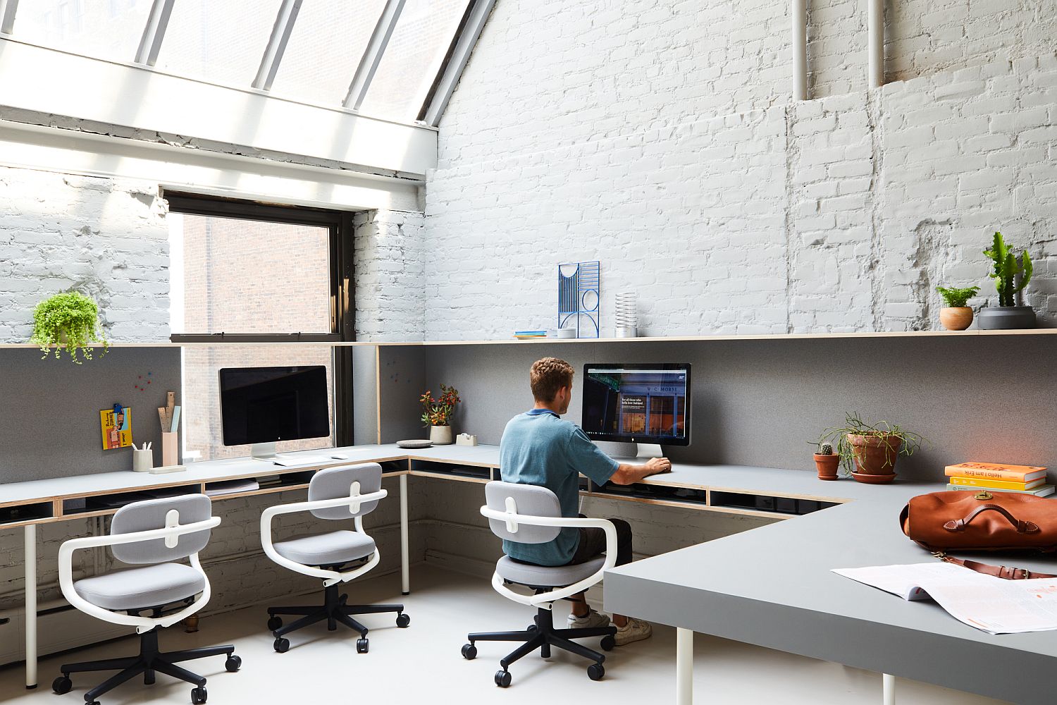 Exposed-brick-walls-and-skylights-shape-a-unqiue-office-space