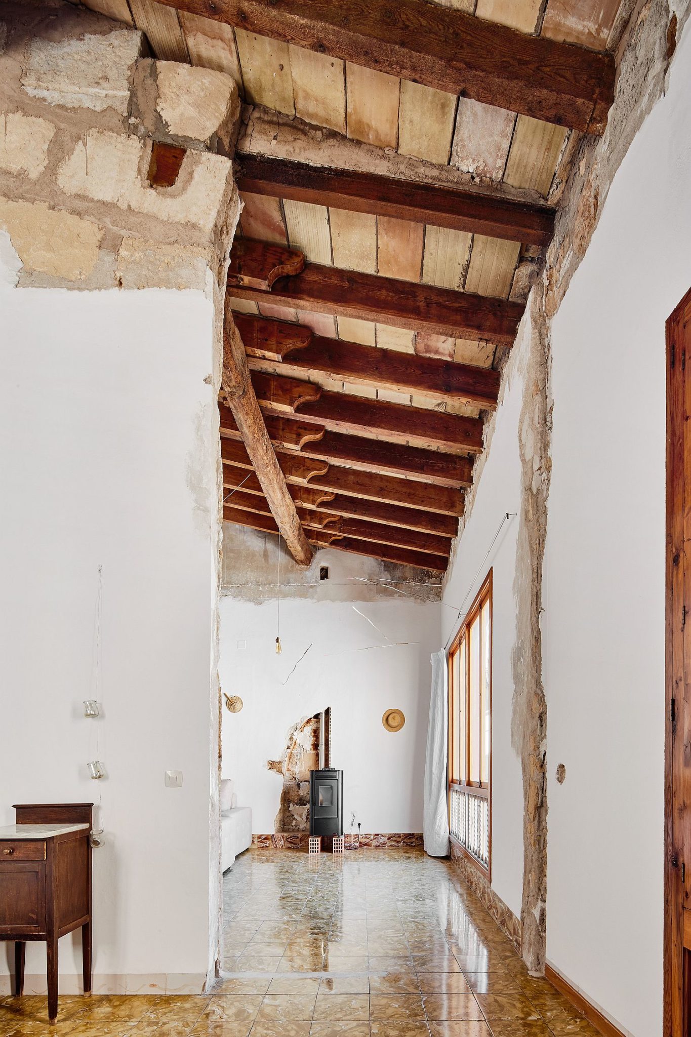 Exposed wooden ceiling and walls give the interior a new look