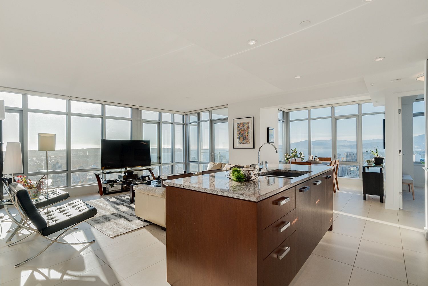 Floor-to-ceiling glass windows bring in spectacular views