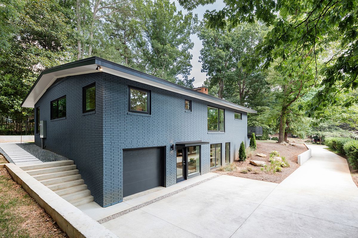 Gray brick exterior of the revamped midcentury house