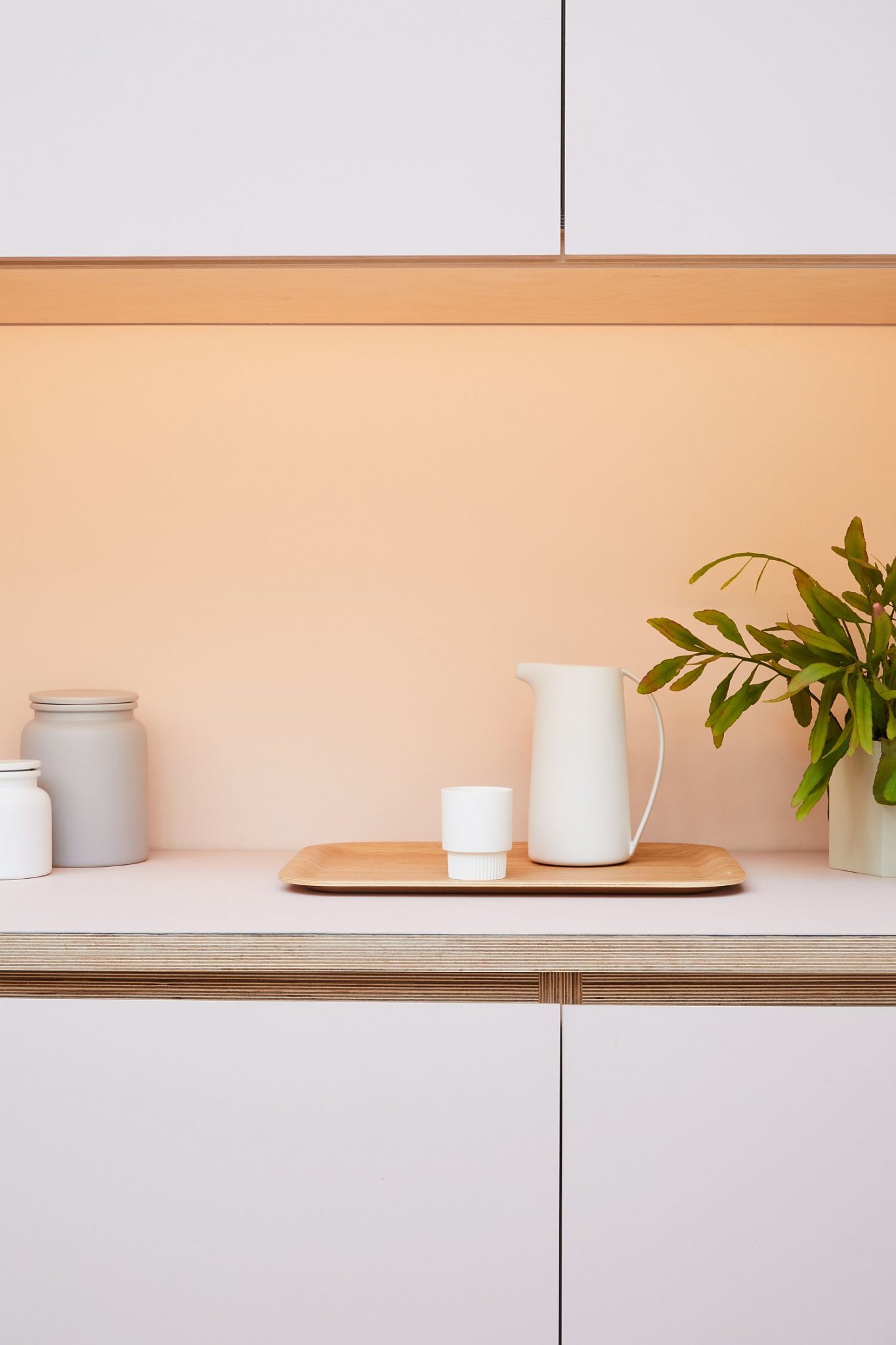 Kitchen-workstation-with-white-cabinets-above