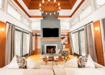 Large-glass-windows-and-walls-draped-in-wood-create-a-cozy-and-light-filled-space-217x155