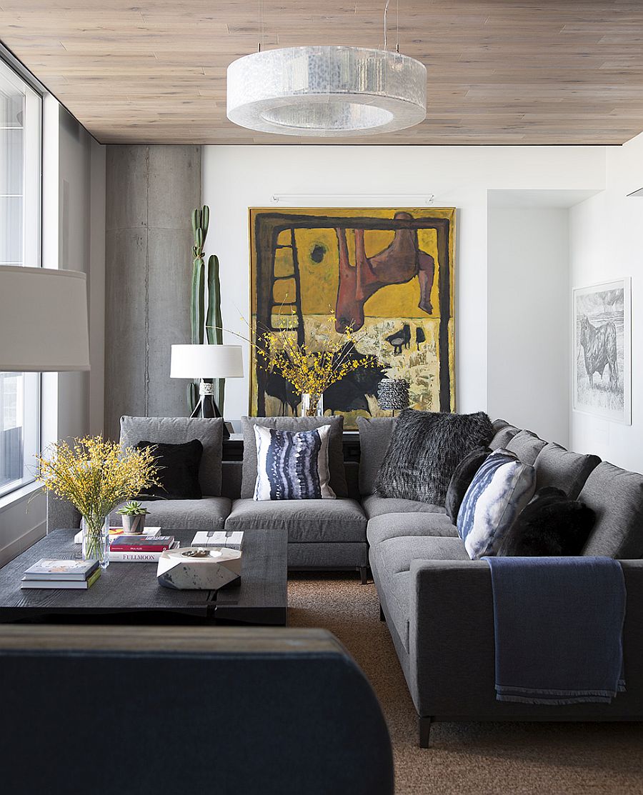 Living room with a comfortable gray couch and a custom coffee table