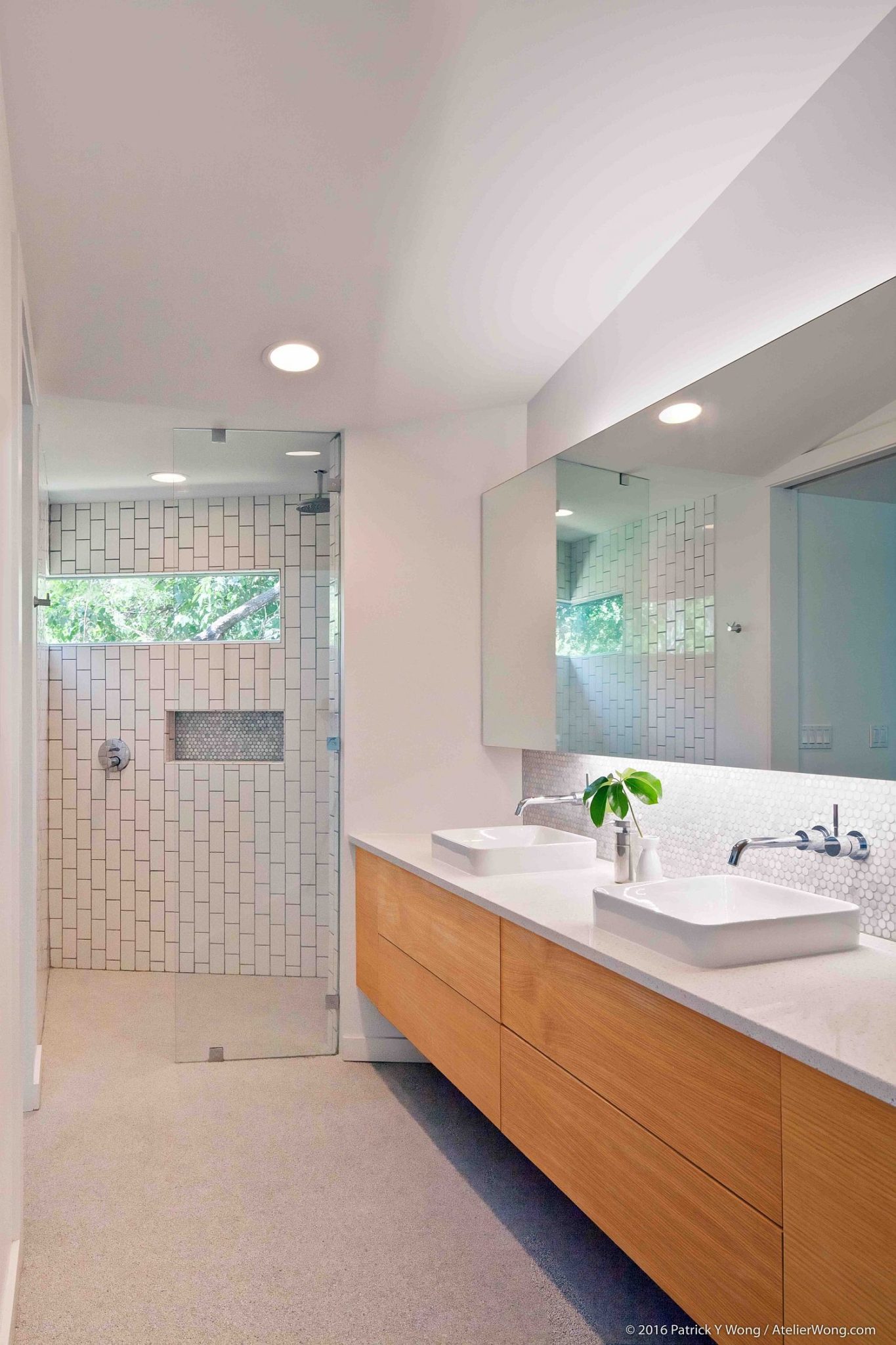 Long-modern-bathroom-in-white-with-floating-wooden-vanity