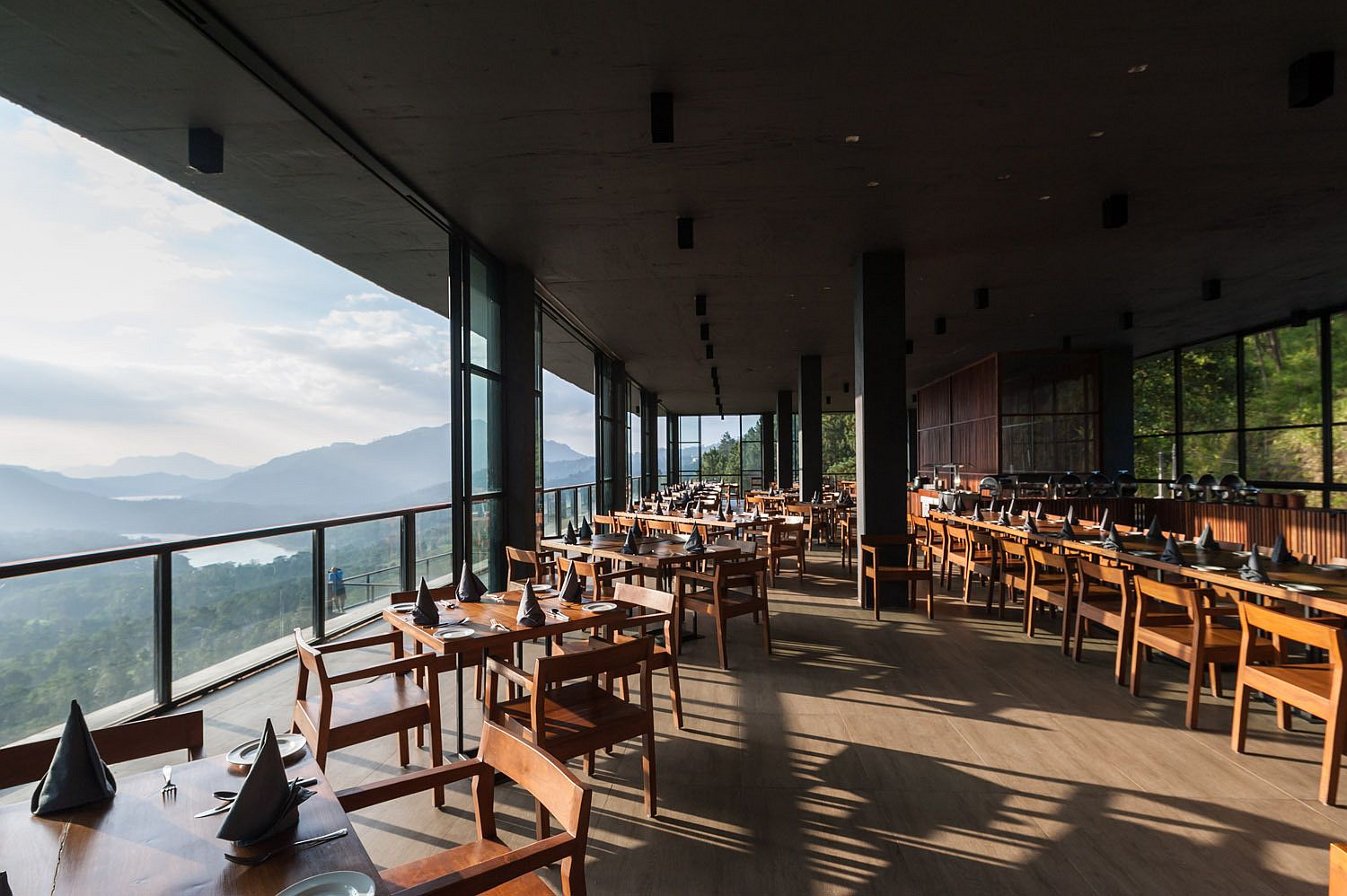 Majestic view of the tropical forests and the distant waterfalls from the restaurant