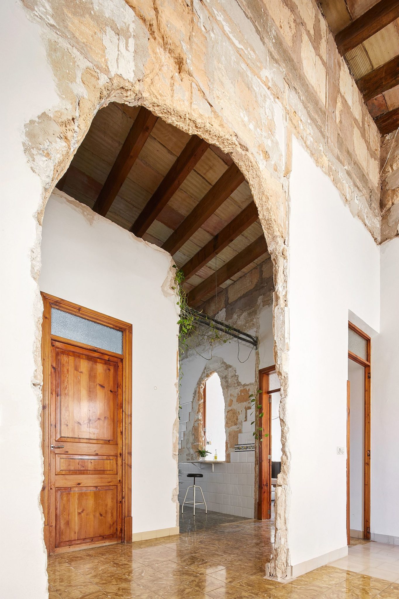 Old archways are left intact and accentuated to create visual contrast