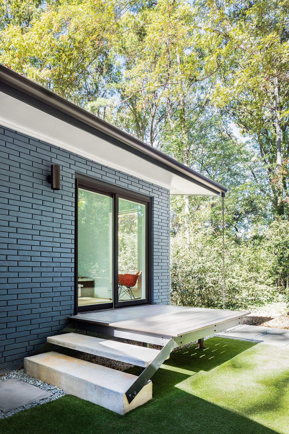 Painted brick exterior of the midcentury modern house in US