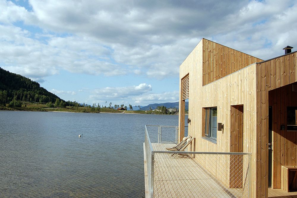 Pinewood and glass cabin next to the lake