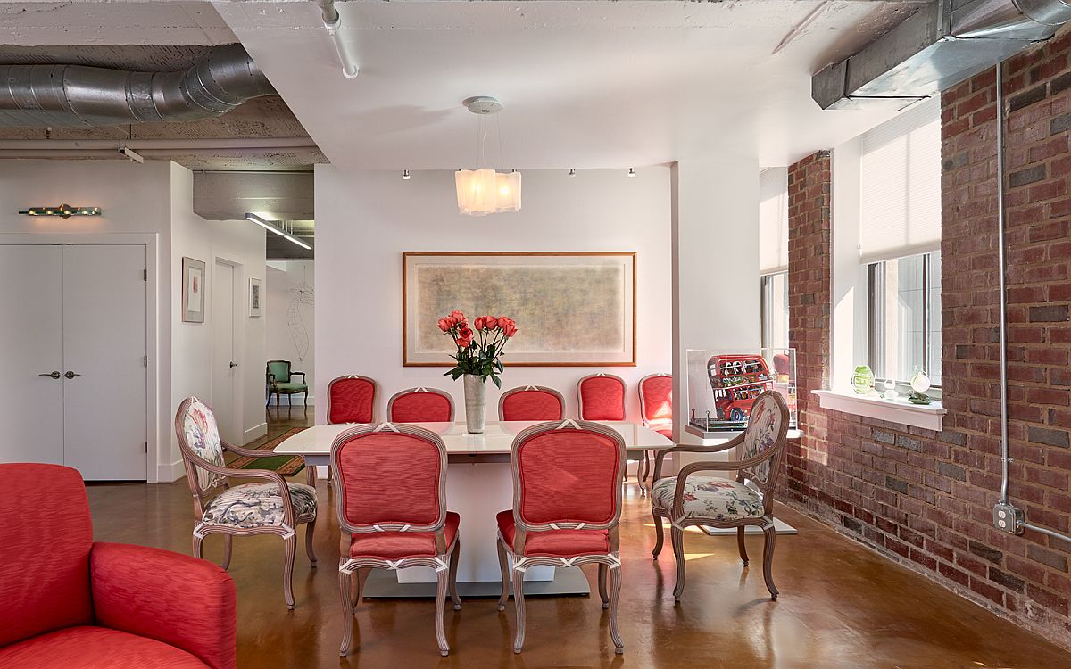 Plush chairs in pink add color to the interior