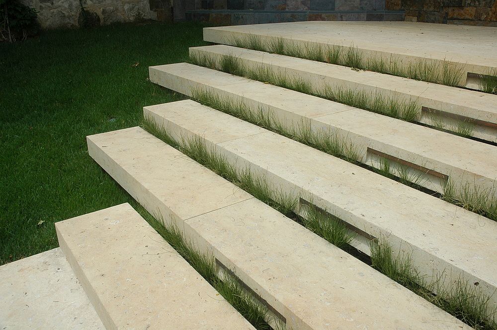 Simple stone steps leading to the poolhouse