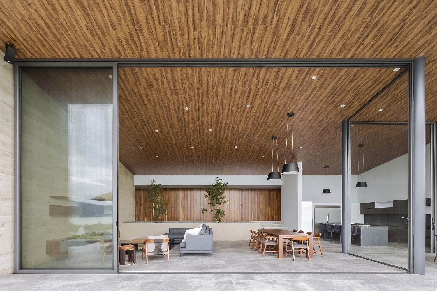 Sliding glass doors of the living area give the home an open and light ambiance