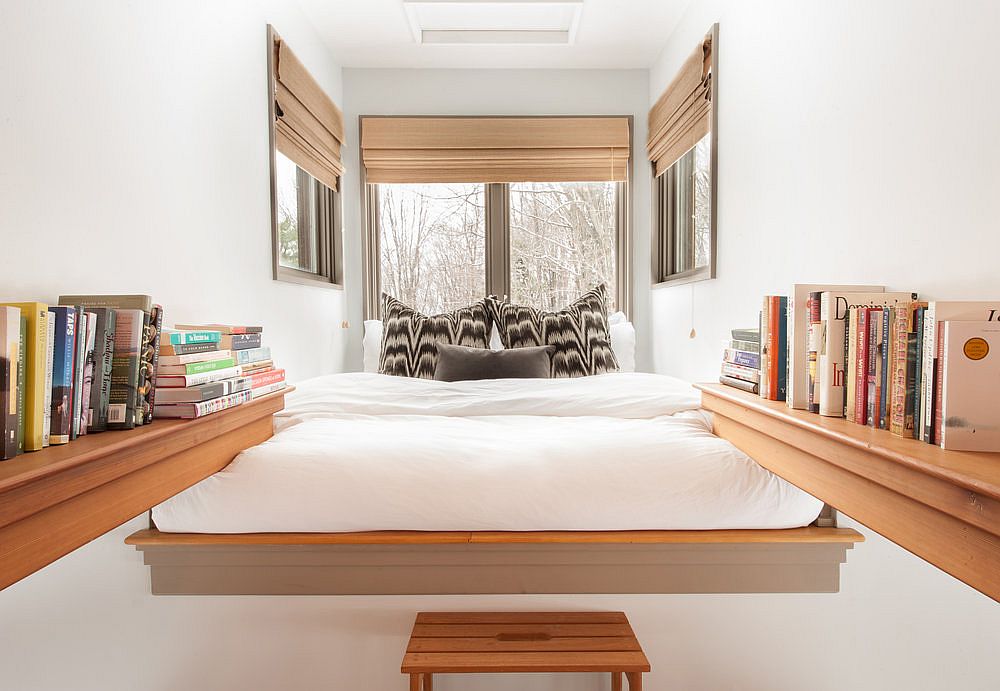 Small loft bedroom with shelves for stacking those books