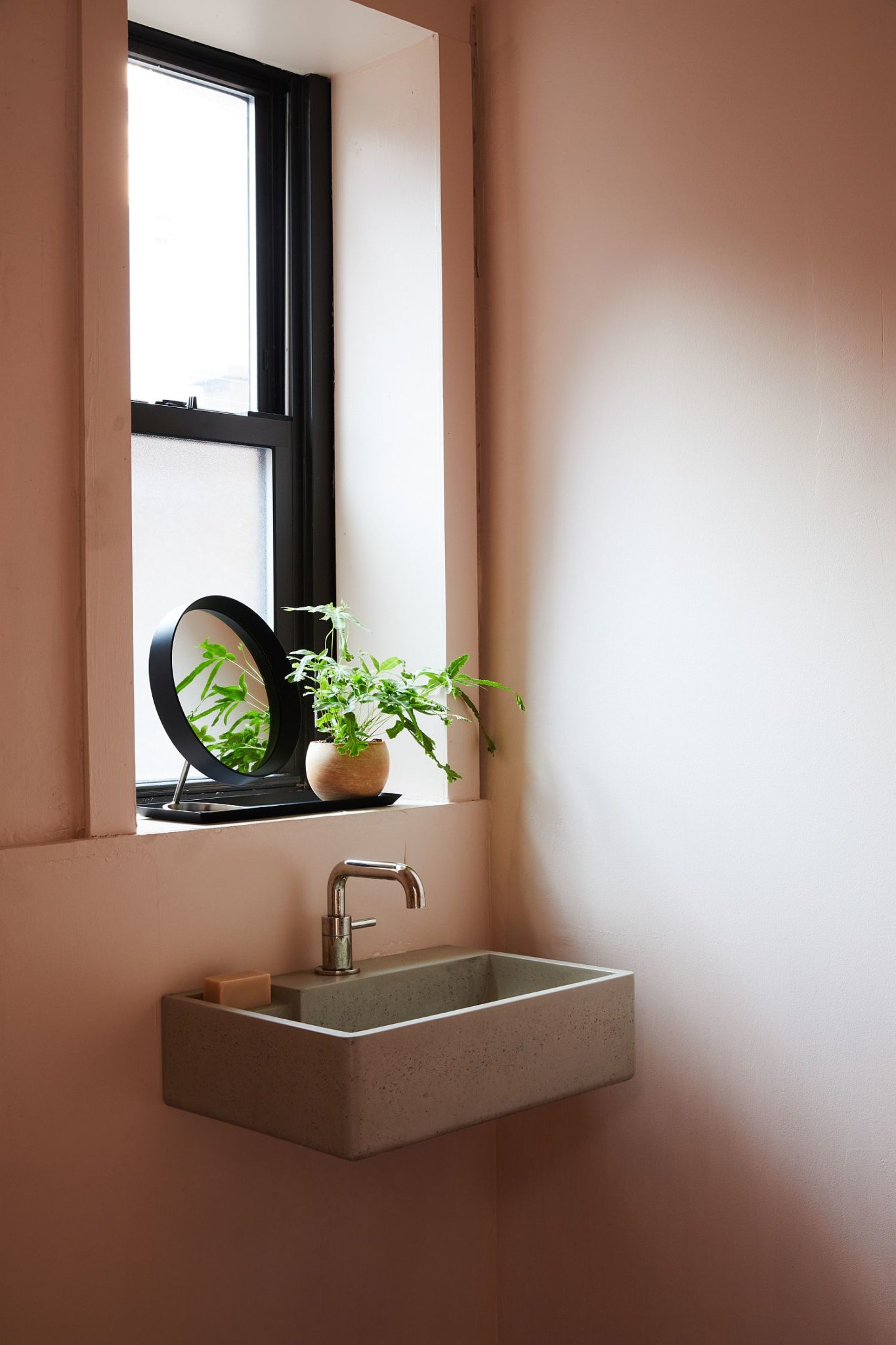 Small sink in the corner is a smart space-saver