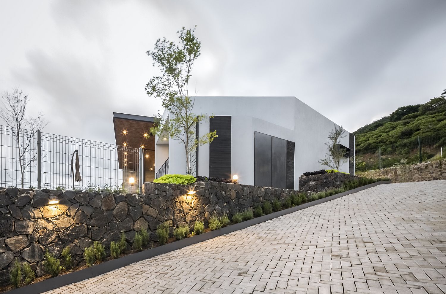Stone walls give the entry a unique and yet modern look