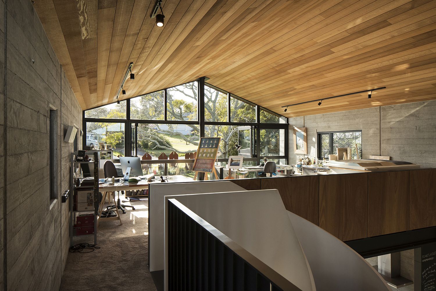 Upper level workspace with ample natural lighting